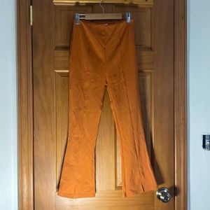 Orange fitted flare bottom trousers
